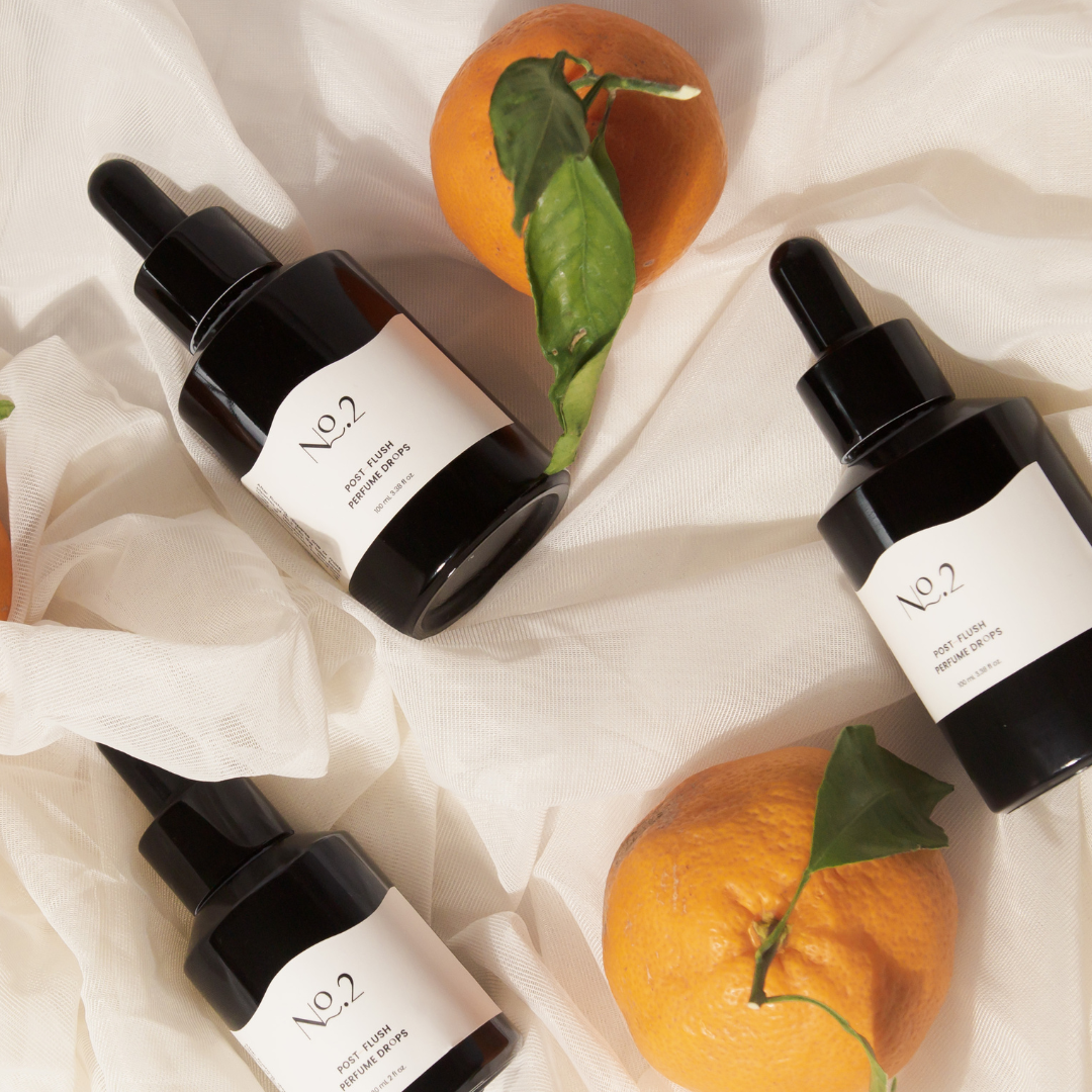 Three bottles of No.2 Drops with citrus fruits